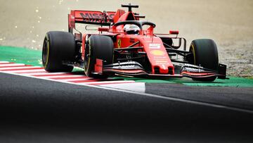 SUZUKA, JAPAN - OCTOBER 11: Sparks fly behind Sebastian Vettel of Germany driving the (5) Scuderia Ferrari SF90 on track during practice for the F1 Grand Prix of Japan at Suzuka Circuit on October 11, 2019 in Suzuka, Japan. (Photo by Clive Mason/Getty Images)