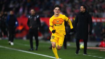 GIRONA, SPAIN - JANUARY 28: Gavi of FC Barcelona runs with the ball during the LaLiga Santander match between Girona FC and FC Barcelona at Montilivi Stadium on January 28, 2023 in Girona, Spain. (Photo by David Ramos/Getty Images)