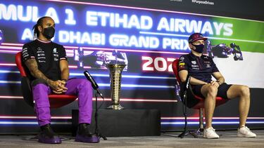 ABU DHABI, UNITED ARAB EMIRATES - DECEMBER 09: Lewis Hamilton of Great Britain and Mercedes GP and Max Verstappen of Netherlands and Red Bull Racing talk in the Drivers Press Conference during previews ahead of the F1 Grand Prix of Abu Dhabi at Yas Marina