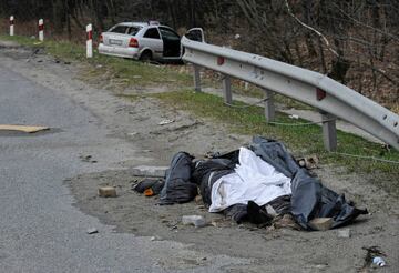 A body of a dead man seen lying on the road not far from the city Bucha.