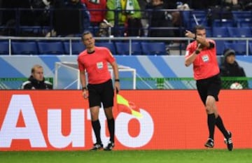 SUITA, JAPAN - DECEMBER 14: Match Referee, Viktor Kassai, awards a penalty for Kashima Antler after he used the video assistant referee to make the decision during the FIFA Club World Cup Semi Final match between Atletico Nacional and Kashima Antlers at S