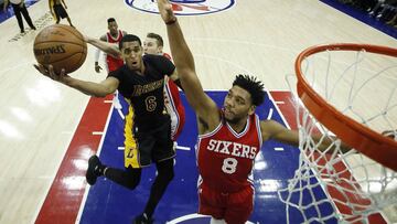Los Angeles Lakers' Jordan Clarkson (6) tries to get a shot past Philadelphia 76ers' Jahlil Okafor (8) during the second half of an NBA basketball game, Friday, Dec. 16, 2016, in Philadelphia. Los Angeles won 100-89. (AP Photo/Matt Slocum)