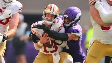 MINNEAPOLIS, MINNESOTA - SEPTEMBER 15: Blake Cashman #51 of the Minnesota Vikings sacks quarterback Brock Purdy #13 of the San Francisco 49ers during the third quarter at U.S. Bank Stadium on September 15, 2024 in Minneapolis, Minnesota. Adam Bettcher/Getty Images/AFP (Photo by Adam Bettcher / GETTY IMAGES NORTH AMERICA / Getty Images via AFP)