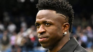 Real Madrid's Brazilian forward Vinicius Junior greets the audience prior the Spanish league football match between Real Madrid CF and Rayo Vallecano de Madrid at the Santiago Bernabeu stadium in Madrid on May 24, 2023. Vinicius drew global support after making a stand against racist abuse he received on May 21 from Valencia supporters at their Mestalla stadium. (Photo by JAVIER SORIANO / AFP)