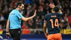 Valencia's Spanish defender #14 Jose Gaya gestures to Spanish referee De Burgos Bengoetxea during the Spanish league football match between Club Atletico de Madrid and Valencia CF at the Metropolitano stadium in Madrid on January 28, 2024. (Photo by JAVIER SORIANO / AFP)