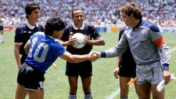 Argentina captain Diego Maradona (l) shakes hands with England captain Peter Shilton (r) as referee Ali Bennaceur (c) checks the match ball is fully inflated and linesman Morera Berny Ulloa (far l) looks on (Photo by Peter Robinson/EMPICS via Getty Image