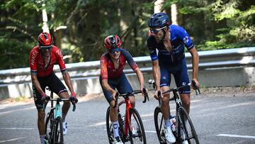 Groupama - FDJ's French rider Thibault Pinot (R), INEOS - Grenadiers' British rider Thomas Pidcock (C) and Team Arkea - Samsic's French rider Warren Barguil (L) cycle in the ascent of the Col du Platzerwasel in the final kilometres of the 20th stage of the 110th edition of the Tour de France cycling race 133 km between Belfort and Le Markstein Fellering, in Eastern France, on July 22, 2023. (Photo by Marco BERTORELLO / AFP)