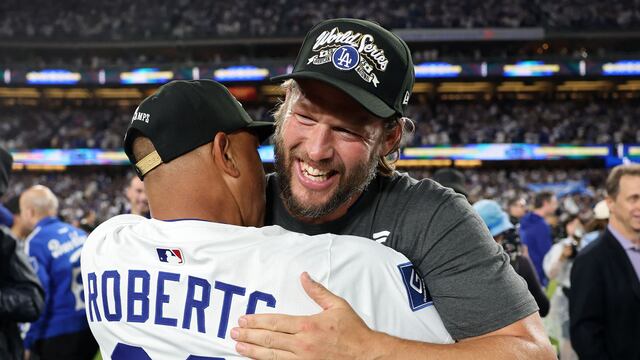 LOS ANGELES, CALIFORNIA - OCTOBER 17: Manager Dave Roberts #30 and Clayton Kershaw #22 of the Los Angeles Dodgers celebrate after defeating the Milwaukee Brewers 5-1 in game four of the National League Championship Series at Dodger Stadium on October 17, 2025 in Los Angeles, California. Sean M. Haffey/Getty Images/AFP (Photo by Sean M. Haffey / GETTY IMAGES NORTH AMERICA / Getty Images via AFP)