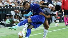 Valencia's Portuguese forward Goncalo Guedes (R) challenges Getafe's Spanish midfielder Carles Alena during the Spanish League football match between Valencia and Getafe at the Mestalla stadium in Valencia on August 13, 2021. (Photo by JOSE JORDAN / AFP)