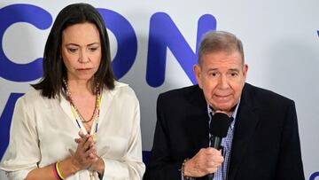 Opposition presidential candidate Edmundo Gonzalez speaks next to Venezuelan opposition leader Maria Corina Machado during a press conference following the announcement by the National Electoral Council that Venezuela's President Nicolas Maduro won the presidential election, in Caracas, Venezuela, July 29, 2024. REUTERS/Maxwell Briceno