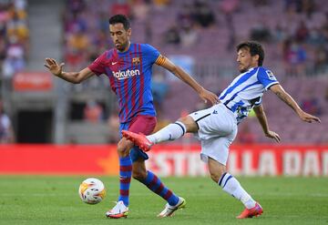 Sergio Busquets y David Silva.