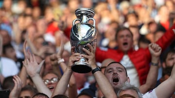 Soccer Football - Euro 2020 - Semi Final - England v Denmark - Wembley Stadium, London, Britain - July 7, 2021 England fans in the stands hold up a replica trophy before the match Pool via REUTERS/Carl Recine