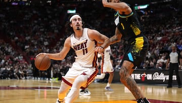 Dec 2, 2023; Miami, Florida, USA;  Miami Heat guard Jaime Jaquez Jr. (11) drives to the basket as Indiana Pacers forward Obi Toppin (1) defends during the second half at Kaseya Center. Mandatory Credit: Jim Rassol-USA TODAY Sports