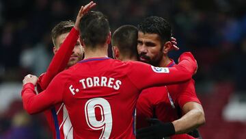 MADRID, SPAIN - JANUARY 09: Yannick Carrasco (2ndR) of Atletico de Madrid celebrates scoring their opening goal with teammates Diego Costa (R) and Fernando Torres (2ndL) during the Copa del Rey second leg match between Club Atletico de Madrid and Lleida E