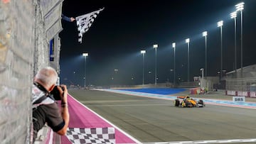 McLaren's Australian driver Oscar Piastri crosses the line to win the sprint race ahead of the Formula One Qatar Grand Prix at the Lusail International Circuit in Lusail on November 29, 2025. (Photo by Altaf Qadri / POOL / AFP)
