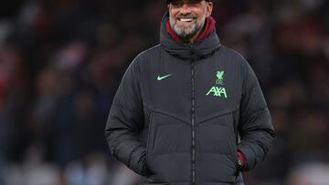 (FILES) Liverpool's German manager Jurgen Klopp smiles on the pitch ahead of the English Premier League football match between Bournemouth and Liverpool at the Vitality Stadium in Bournemouth, southern England on January 21, 2024. Liverpool manager Jurgen Klopp announced the shock decision on January 26, 2024 that he will leave the club at the end of the season. (Photo by Adrian DENNIS / AFP) / RESTRICTED TO EDITORIAL USE. No use with unauthorized audio, video, data, fixture lists, club/league logos or 'live' services. Online in-match use limited to 120 images. An additional 40 images may be used in extra time. No video emulation. Social media in-match use limited to 120 images. An additional 40 images may be used in extra time. No use in betting publications, games or single club/league/player publications. / 