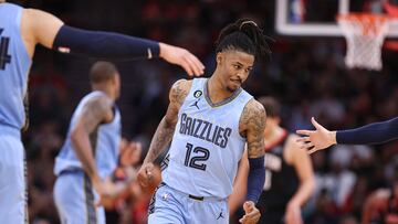 Memphis Grizzlies guard Ja Morant (12) reacts after scoring a basket during the third quarter against the Houston Rockets at Toyota Center.