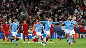 Manchester City's players celebrate victory after the penalty shootout of the 2023 UEFA Super Cup football match between Manchester City and Sevilla at the Georgios Karaiskakis Stadium in Piraeus on August 16, 2023. (Photo by Aris MESSINIS / AFP)