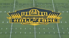 Pro Football Hall of Fame golden logo at midfield commemorating Super Bowl 50 at Tom Benson Hall of Fame Stadium.