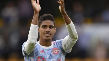 Soccer Football - Premier League - Wolverhampton Wanderers v Manchester United - Molineux Stadium, Wolverhampton, Britain - August 29, 2021 Manchester United's Raphael Varane applauds fans after the match REUTERS/Tony Obrien EDITORIAL USE ONLY. No us