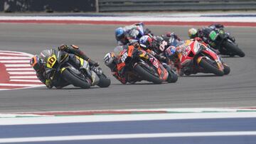 Apr 10, 2022; Austin, Texas, USA; Riders including Luca Marini of Italy (10), Miguel Oliveira of Portugal (88) and Marc Marquez of Spain (93) take a turn during the MotoGP race at the Red Bull Grand Prix of the Americas MotoGP at Circuit of the Americas. 