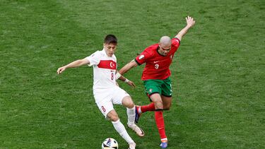 Portugal's defender #03 Pepe fights for the ball with Turkey's forward #08 Arda Guler during the UEFA Euro 2024 Group F football match between Turkey and Portugal at the BVB Stadion in Dortmund on June 22, 2024. (Photo by KENZO TRIBOUILLARD / AFP)