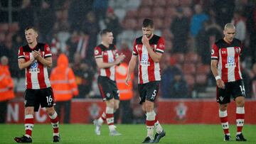 Soccer Football - Premier League - Southampton v Leicester City - St Mary's Stadium, Southampton, Britain - October 25, 2019 Southampton's Jack Stephens, James Ward-Prowse and Oriol Romeu look dejected at the end of the match