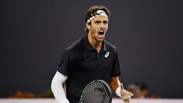 Italy�s Lorenzo Musetti reacts after winning a point against France�s Giovanni Mpetshi Perricard during their men�s singles match at the China Open tennis tournament in Beijing on September 26, 2025. (Photo by GREG BAKER / AFP)