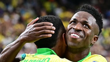 Brazil's forward #07 Vinicius Junior celebrates with Brazil's forward #20 Savinho after Savinho scored the team's second goal during the Conmebol 2024 Copa America tournament group D football match between Paraguay and Brazil at Allegiant Stadium in Las Vegas, Nevada on June 28, 2024. (Photo by Frederic J. Brown / AFP) / ALTERNATE CROP