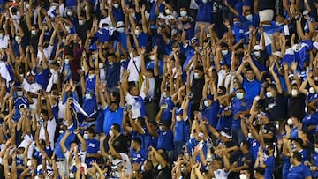 Fans of El Salvador cheer for their team during their Qatar 2020 FIFA World Cup Concacaf qualifier football match against Mexico at Cuscatlan Stadium, in San Salvador, on October 13, 2021. (Photo by MARVIN RECINOS / AFP)