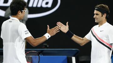 Tennis - Australian Open - Men's singles semifinals - Rod Laver Arena, Melbourne, Australia, January 26, 2018. Chung Hyeon of South Korea shakes hands with Roger Federer of Switzerland after Chung retired from their match. REUTERS/Thomas Peter