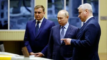 Russia's President Vladimir Putin, flanked by Tula's Region Governor Alexei Dyumin (L), listens to explanations from Shcheglovsky Val Director General Alexei Visloguzov (R) as he visits the Shcheglovsky Val machine building plant, a subsidiary of KBP Instrument Design Bureau, in Tula, Russia, on December 23, 2022. (Photo by SPUTNIK / AFP) (Photo by -/SPUTNIK/AFP via Getty Images)