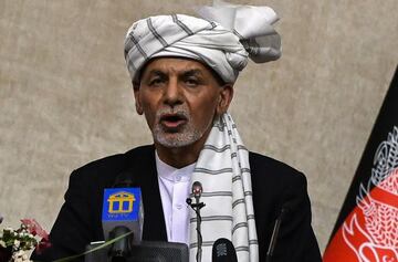 (FILES) In this file photo taken on August 2, 2021, Afghanistan's President Ashraf Ghani speaks during a meeting at the Afghan Parliament house in Kabul. - Ghani said on August 15 after fleeing the country that the Taliban had won, as the militants entere