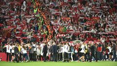 Sevilla&#039;s players and staff celebrate with supporters 