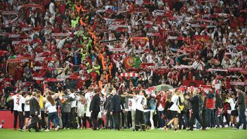 Sevilla&#039;s players and staff celebrate with supporters 