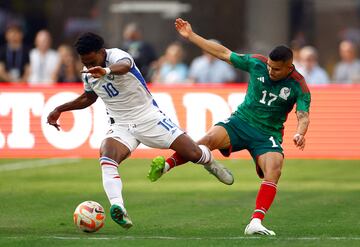 Yoel Barcenas #10 of Panama controls the ball against Orbelin Pineda #17 of Mexico 