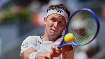 Casper Ruud of Norway returns the ball against against Russia's Daniil Medvedev during the Madrid Open tennis tournament in Madrid, Spain, Thursday, May 1, 2025. (AP Photo/Manu Fernandez)