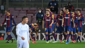 Barcelona&#039;s Argentinian forward Lionel Messi (C) celebrates with teammates after scoring a goal during the Spanish League football match between Barcelona and SD Huesca at the Camp Nou stadium in Barcelona on March 15, 2021. (Photo by LLUIS GENE / AF