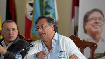 Colombian presidential candidate for the 'Colombia Humana' political party and Historic Pact Coalition, Gustavo Petro (R), delivers a press conference after a meeting with victims of the Colombian conflict who won a seat in the Congress in the last legislative election, in Bogota on April 5, 2022. (Photo by Raul ARBOLEDA / AFP) (Photo by RAUL ARBOLEDA/AFP via Getty Images)