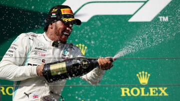 Formula One F1 - Hungarian Grand Prix - Hungaroring, Budapest, Hungary - August 4, 2019 Mercedes' Lewis Hamilton celebrates winning the Hungarian Grand Prix with champagne REUTERS/Lisi Niesner TPX IMAGES OF THE DAY
