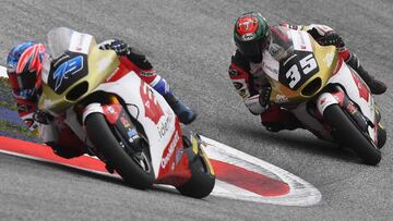 Idemitsu Honda Team Asia's Japanese rider Ai Ogura (L) and Idemitsu Honda Team Asia's Thailand rider Somkiat Chantra compete in the Moto2 Austrian Grand Prix race at the Redbull Ring racetrack in Spielberg on August 21, 2022. (Photo by VLADIMIR SIMICEK / AFP) (Photo by VLADIMIR SIMICEK/AFP via Getty Images)
