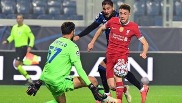 Liverpool's Portuguese striker Diogo Jota (R) scores a goal despite Atalanta's Italian goalkeeper Marco Sportiello (L) during the UEFA Champions league football match Atalanta Bergamo vs Liverpool, on November 3, 2020 at the Atalanta stadium in