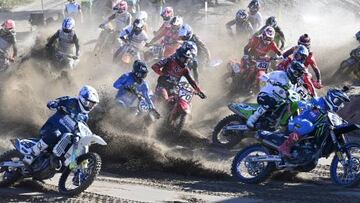 France's Romain Febvre (Center R, #3) and Swiss Jeremy Seewer (Bottom R) compete during the start of the MXGP qualification race in the Motocross GP world championship competition in Hyvinka, Finland, on August 13, 2022. - Finland OUT (Photo by Jussi Nukari / Lehtikuva / AFP) / Finland OUT (Photo by JUSSI NUKARI/Lehtikuva/AFP via Getty Images)