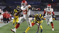 Kansas City Chiefs running back Kareem Hunt (27) scores a touchdown ahead of Los Angeles Rams free safety Lamarcus Joyner (20) as Chiefs offensive guard Cameron Erving (75) looks on during the first half of an NFL football game, Monday, Nov. 19, 2018, in Los Angeles. (AP Photo/Marcio Jose Sanchez)