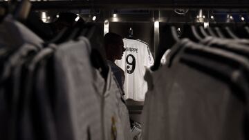 People buy the newly launched jersey of French footballer Killyan Mbappe at the Real Madrid's official store in the Santiago Bernabeu stadium in Madrid on July 11, 2024. (Photo by Pierre-Philippe MARCOU / AFP)