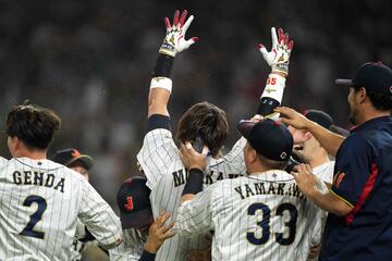 Munetaka Murakami #55 of Team Japan celebrates with teammates after hitting a two-run double to defeat Team Mexico 6-5 in the World Baseball Classic Semifinals at loanDepot park on March 20, 2023 in Miami, Florida. 