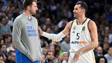 Dallas Mavericks' guard and former Real Madrid player Luka Doncic talks with Real Madrid's Spanish forward Rudy Fernandez