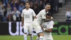 Marseille&#039;s Dimitri Payet, right, Marseille&#039;s Dario Benedetto, Marseille&#039;s Maxime Lopez celebrate after Lille&#039;s Gabriel scored an own goal during the French League One soccer match between Marseille and Lille at the Velodrome stadium i
