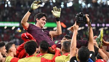 06 December 2022, Qatar, Al-Rajjan: Soccer, World Cup, Morocco - Spain, Final round, Round of 16, Education City Stadium, Morocco's goalkeeper Bono and his teammates cheer after winning the penalty shootout. Photo: Robert Michael/dpa (Photo by Robert Michael/picture alliance via Getty Images)