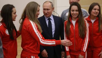 NOVO-OGARYOVO, RUSSIA - JANUARY 31: (RUSSIA OUT) Russian President Vladimir Putin (C) poses for a photo with Olympic athletes who will take part in the upcoming 2018 Pyeongchang Winter Olympic Games, on January 31, 2018 at Novo-Ogaryovo State Residence, 10 km. west of Moscow, Russia. (Photo by Mikhail Svetlov/Getty Images)